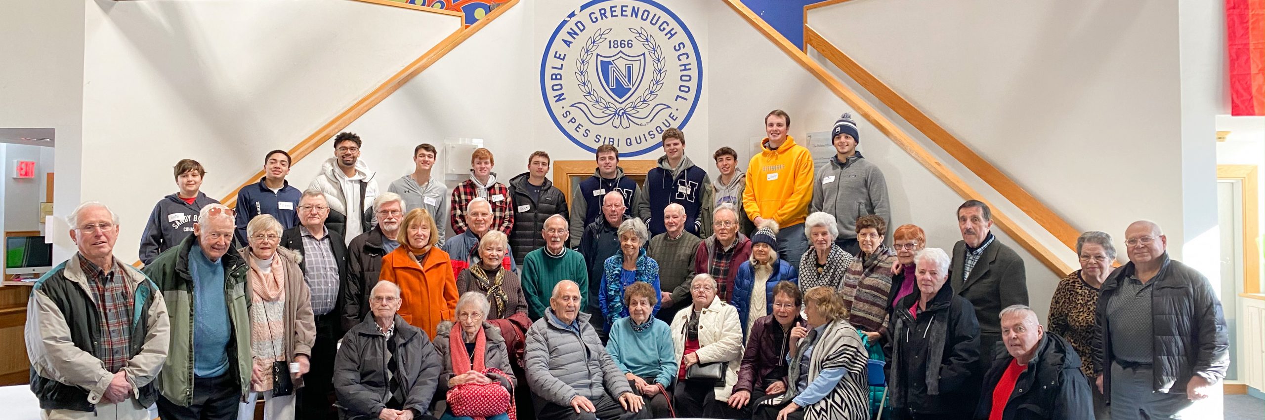 Nobles student volunteers with elder friends, the Golden Dawgs