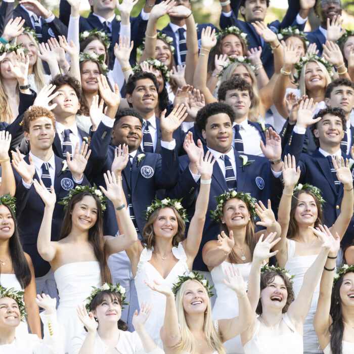 Closeup of some members of Nobles' Class of 2026 before graduation assembly